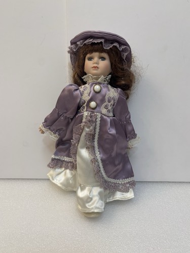 Vintage porcelain doll - 12”,