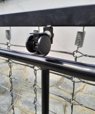 Rete letto singola,a molle,colore nero con rotelle,con materasso,come nuova