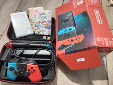 Nintendo Switch Con Joy Rosso/Blu Neon Con 5 Giochi In Dotazione 