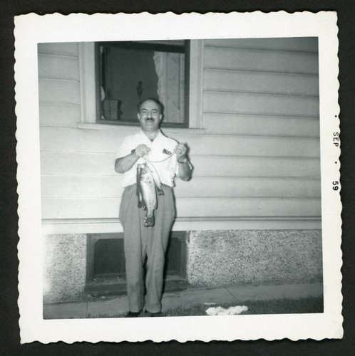 Happy fisherman man holds fish - happy,