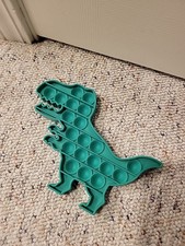 Dinosauro verde tattile - verde,