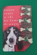   Scheda telefonica usata Buone Feste Natale 1997 Cane con ossi come foto
