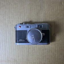 Petri fotocamera a - f/1.9,