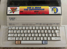 MACCHINA DA SCRIVERE CANON "QT 1200" con cover tastiera e scatola originale - Leggi bene