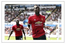 PAUL POGBA MANCHESTER FIRMATO