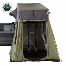 Tenda da tetto OVS HD Nomadic 3 annesso base verde con pavimento nero e copertura da viaggio