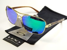 Occhiali da sole Oakley Sanctuary oro verde polarizzati deviazione crosshair contrail