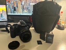 REFLEX NIKON D3100 + OBIETTIVO AF-S NIKKOR 55-200mm + CARICATORE + BATTERIE