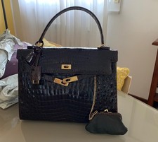 Borsa made in italy modello Kelly anni 90 in vero coccodrillo color marrone. 