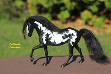 Statua cavallo trottola in