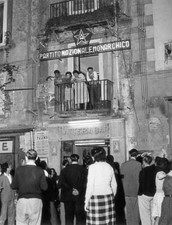 people looking out balcony