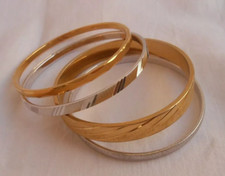 LOTTO 4 BRACCIALI MONET RIGIDI IN METALLO COLORE ORO E ARGENTO