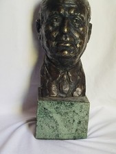 testa in bronzo fimata