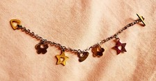 Bracciale Kris by Rebecca.Catena metallo con charms floreali.Mai indossato.