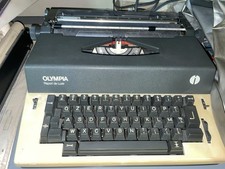 Olympia Report De Luxe