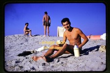 Shirtless Man at a Beach in