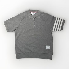 Polo Thom Browne grigia a