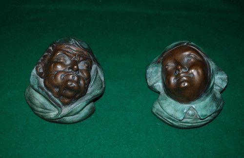 Coppia teste bronzo - in,