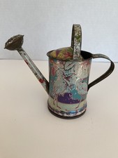 Antico annaffiatoio vintage in