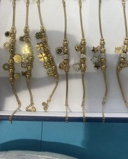 Bracciali in acciaio inox dorato con charm