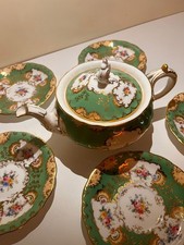 Piattini e teiera di ricambio