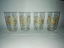 N. 4 BICCHIERI CON DECORAZIONI IN RILIEVO COLOR ORO D 6,50 X CM. 10