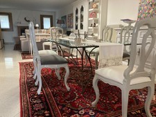 Tavolo da pranzo in cristallo con base in ferro battuto