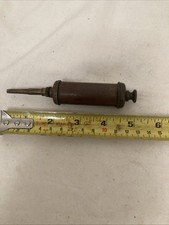 small vintage brass grease