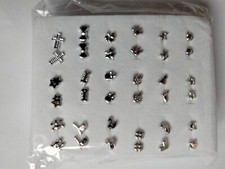 Set 18 paia di orecchini a forma di cuore, fiocco, croce colore argento 