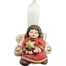 Thun Angelo Rosso di Natale con stella d'orata in mano in porta candela a stella