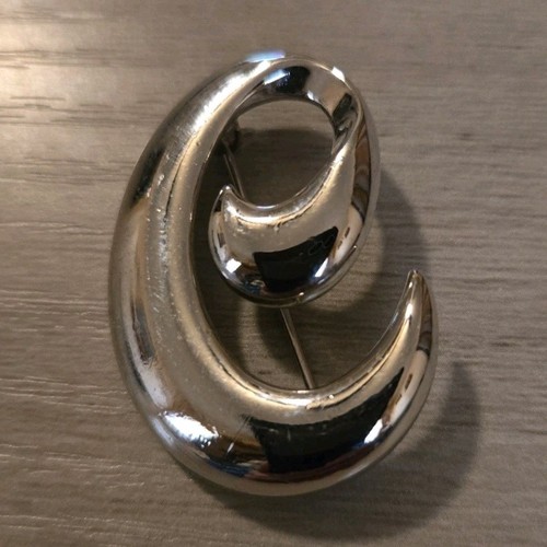 Spilla vortice metallo - in,