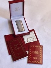 ACCENDINO CARTIER SANTOS In acciaio con bulloni d’oro, ottimo stato