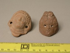 Coppia di teste in ceramica
