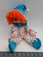 Bambola musicale pagliaccio in