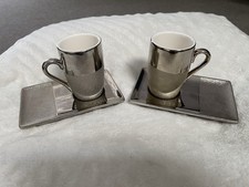 Coppia di tazzine e piattini