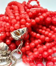COLLANA MULTIFILO , PERLE ROSSE DI PLASTICA