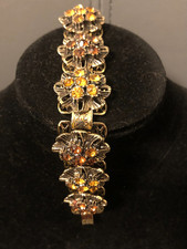 BEL BRACCIALE DORATO, DECORATO CON STRASS TONALITA' TOPAZIO