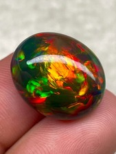 Opale di fuoco etiope naturale 13,8 carati pietra preziosa cabochon nero fumè 19,4x16 mm