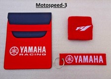 porta documenti  yamaha  rosso  + polsino r1  + portachiavi  .