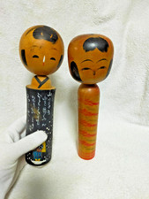 Bambole giapponesi in legno