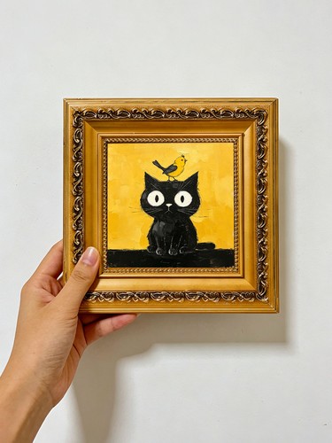 Gatto nero con - , uccellino