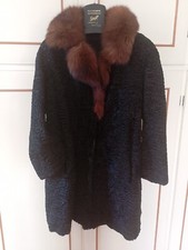pelliccia astrakan nero con collo volpe