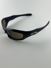 Oakley Monster Dog montatura nera opaca lenti bronzo icone argento SI edizione standard