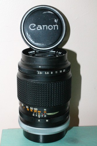 Canon 135 2 - +,
