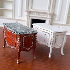  Cassettiera in legno dorato