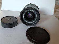 TELEOBIETTIVO CANON FD 135 mm 1:3,5 con paraluce e filtro Lumix