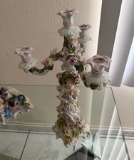 Antico candelabro statuina in
