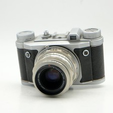 Altix Altissa con fotocamera analogica Zeiss Tessar 50 mm F2.8 - rivenditore foto -