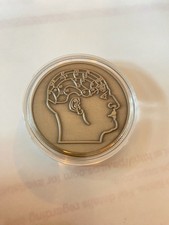 Moneta sfida testa frenologia