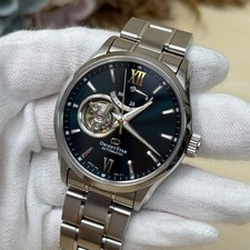 Orologio automatico ORIENT STAR F6R4-UAA0 scheletro nero acciaio...